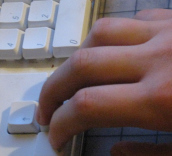 hand typing on keyboard