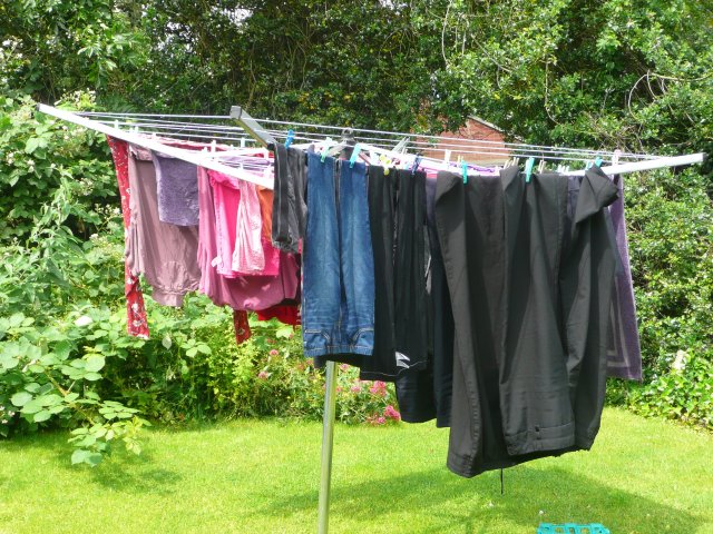 washing hanging out on the line, complete with pegs!